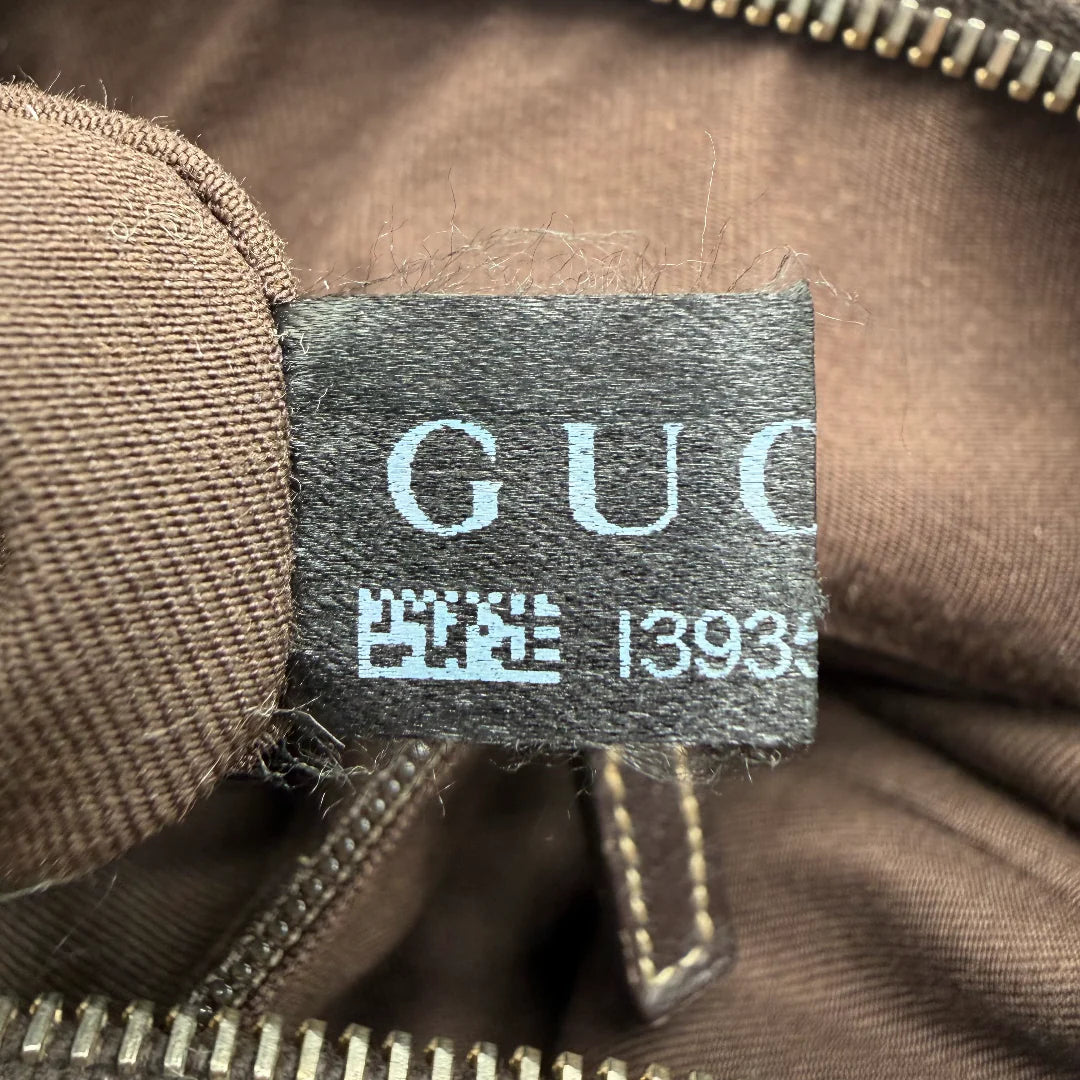 https://cdn.shopify.com/s/files/1/0564/9376/8855/files/Gucci_Schultertasche_D-Ring_large_monogram_beige_vintage_GG_0734.webp?v=1772111450