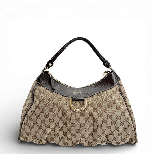 https://cdn.shopify.com/s/files/1/0564/9376/8855/files/Gucci_Schultertasche_D-Ring_large_monogram_beige_vintage_GG_0812.webp?v=1770828669