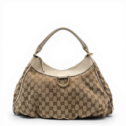 https://cdn.shopify.com/s/files/1/0564/9376/8855/files/Gucci_Schultertasche_D-Ring_large_monogram_beige_vintage_GG_1490.webp?v=1772707062