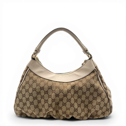 https://cdn.shopify.com/s/files/1/0564/9376/8855/files/Gucci_Schultertasche_D-Ring_large_monogram_beige_vintage_GG_1492.webp?v=1772707096