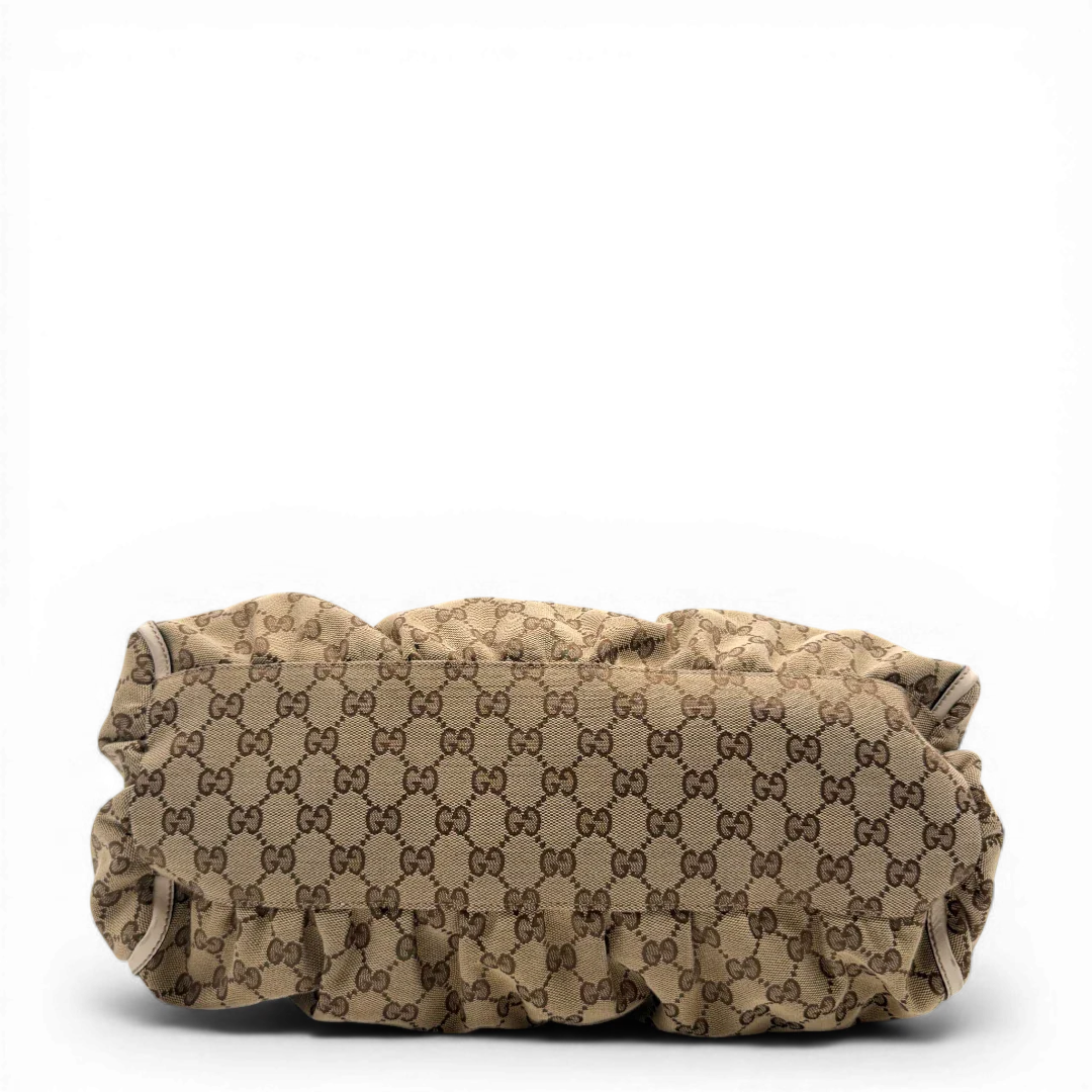 https://cdn.shopify.com/s/files/1/0564/9376/8855/files/Gucci_Schultertasche_D-Ring_large_monogram_beige_vintage_GG_1495.webp?v=1772707096