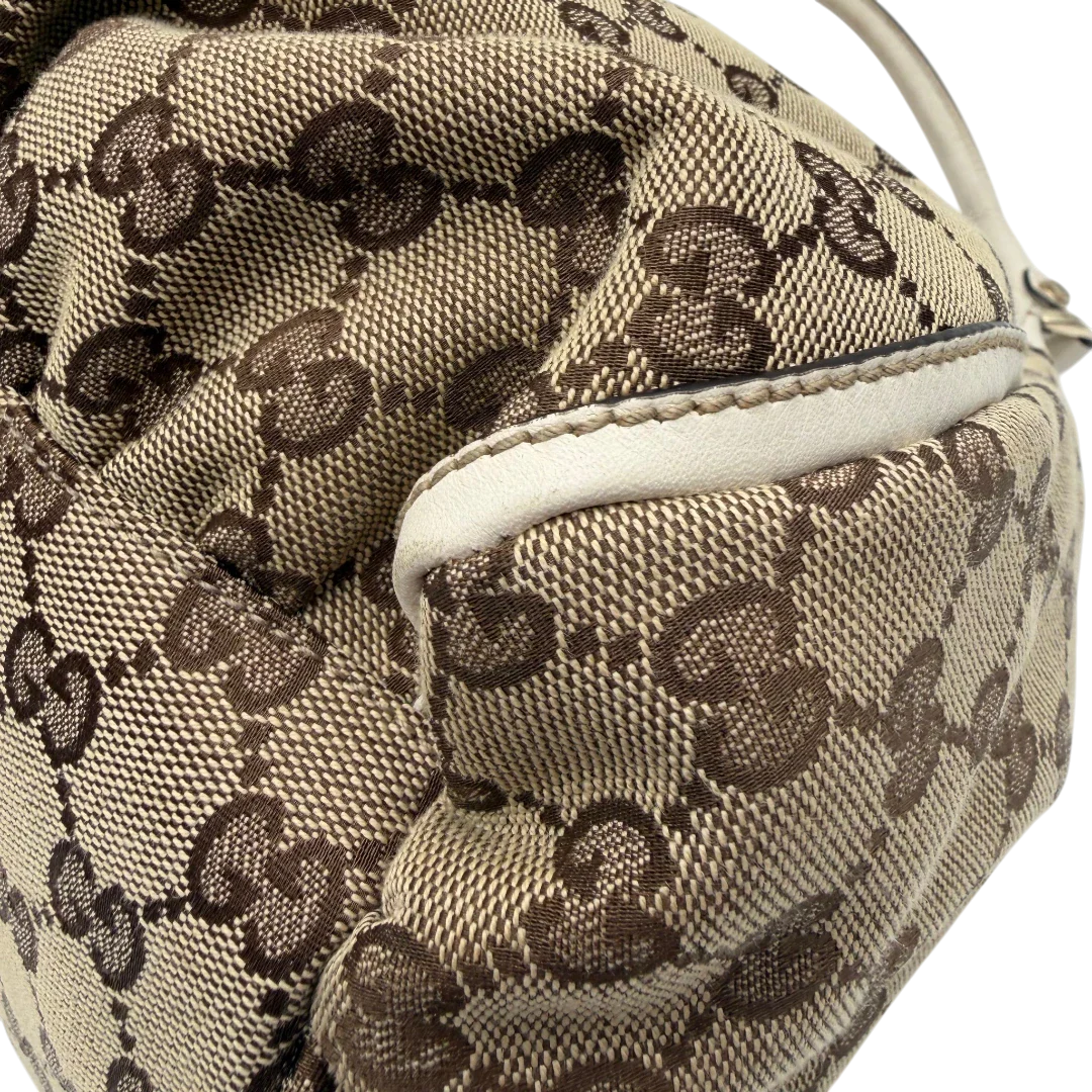 https://cdn.shopify.com/s/files/1/0564/9376/8855/files/Gucci_Schultertasche_D-Ring_large_monogram_beige_vintage_GG_1498.webp?v=1772707096