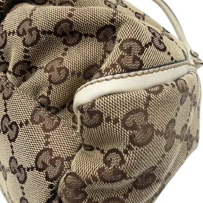 https://cdn.shopify.com/s/files/1/0564/9376/8855/files/Gucci_Schultertasche_D-Ring_large_monogram_beige_vintage_GG_1498.webp?v=1772707096