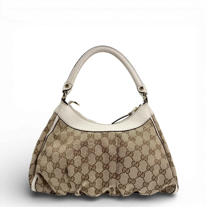 https://cdn.shopify.com/s/files/1/0564/9376/8855/files/Gucci_Schultertasche_D-Ring_medium_Lederdetails_weiss_monogram_beige_vintage_GG_0956.webp?v=1770890512