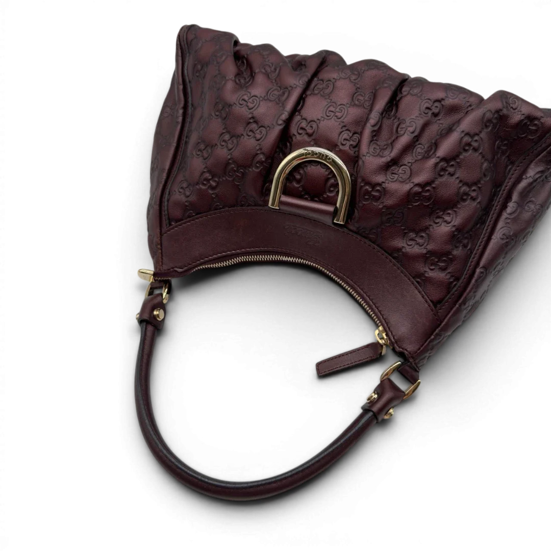 https://cdn.shopify.com/s/files/1/0564/9376/8855/files/Gucci_Schultertasche_D-Ring_medium_aus_Leder_monogram_lila_10.webp?v=1784283699