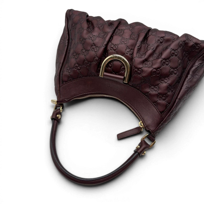 https://cdn.shopify.com/s/files/1/0564/9376/8855/files/Gucci_Schultertasche_D-Ring_medium_aus_Leder_monogram_lila_10.webp?v=1784283699