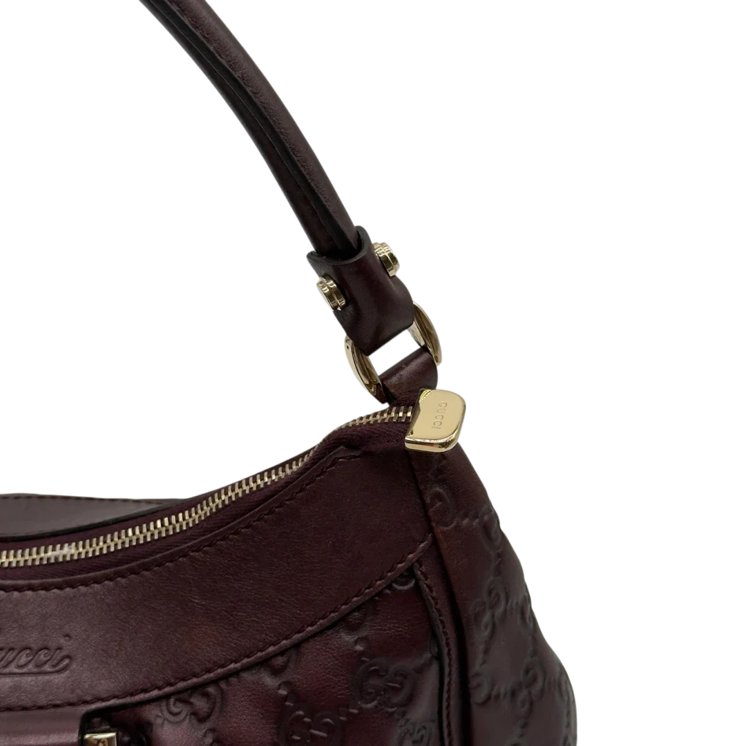 https://cdn.shopify.com/s/files/1/0564/9376/8855/files/Gucci_Schultertasche_D-Ring_medium_aus_Leder_monogram_lila_13.webp?v=1784283698