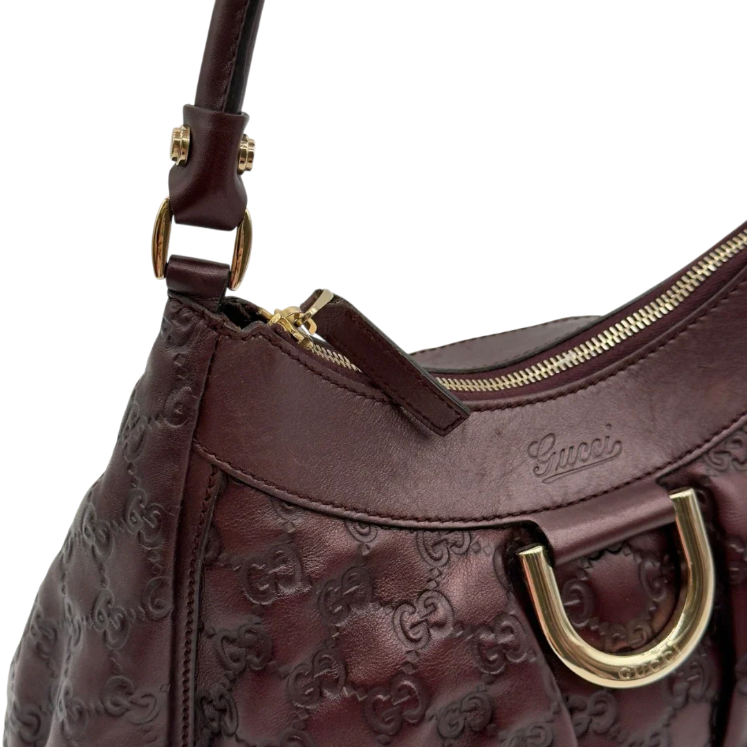 https://cdn.shopify.com/s/files/1/0564/9376/8855/files/Gucci_Schultertasche_D-Ring_medium_aus_Leder_monogram_lila_14.webp?v=1784283698