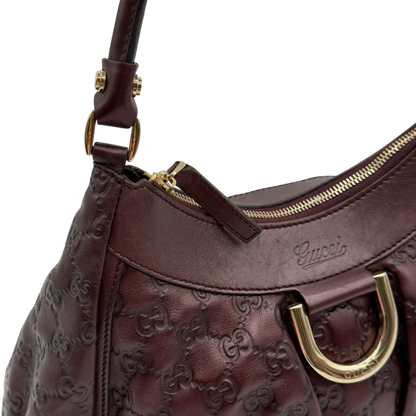 https://cdn.shopify.com/s/files/1/0564/9376/8855/files/Gucci_Schultertasche_D-Ring_medium_aus_Leder_monogram_lila_14.webp?v=1784283698