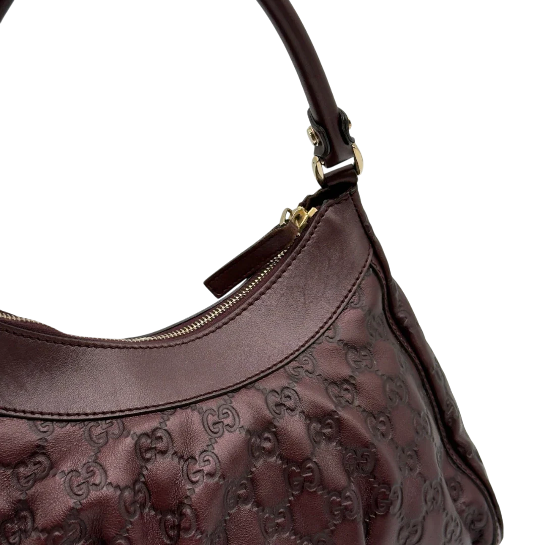 https://cdn.shopify.com/s/files/1/0564/9376/8855/files/Gucci_Schultertasche_D-Ring_medium_aus_Leder_monogram_lila_15.webp?v=1784283699