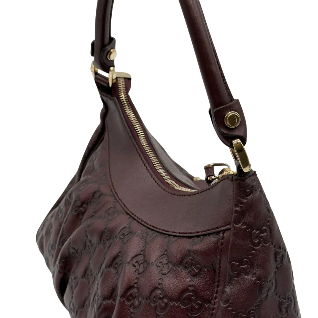 https://cdn.shopify.com/s/files/1/0564/9376/8855/files/Gucci_Schultertasche_D-Ring_medium_aus_Leder_monogram_lila_16.webp?v=1784283698
