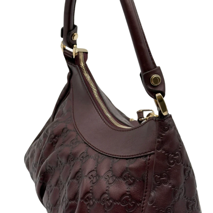 https://cdn.shopify.com/s/files/1/0564/9376/8855/files/Gucci_Schultertasche_D-Ring_medium_aus_Leder_monogram_lila_16.webp?v=1784283698