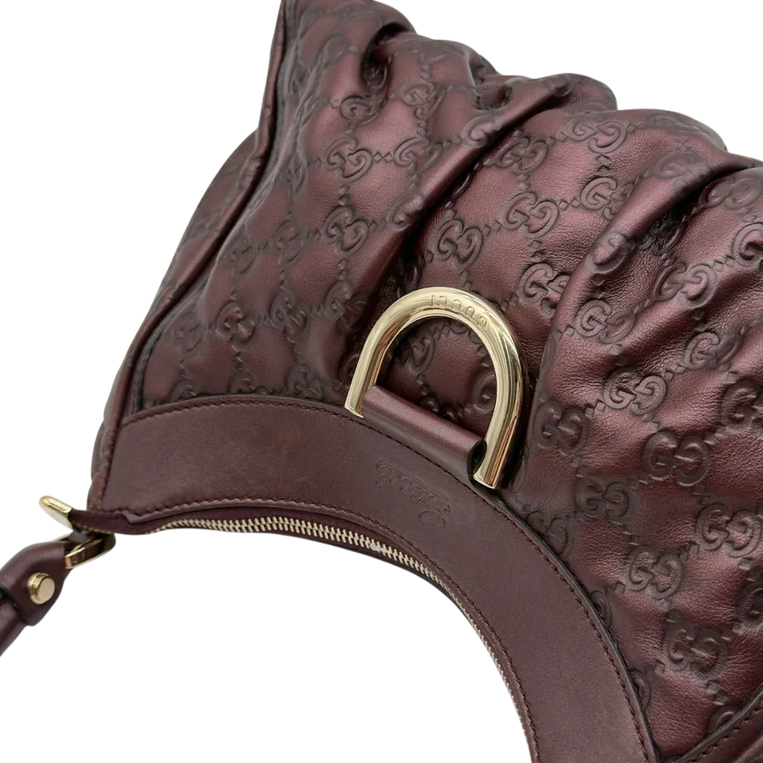 https://cdn.shopify.com/s/files/1/0564/9376/8855/files/Gucci_Schultertasche_D-Ring_medium_aus_Leder_monogram_lila_17.webp?v=1784283699