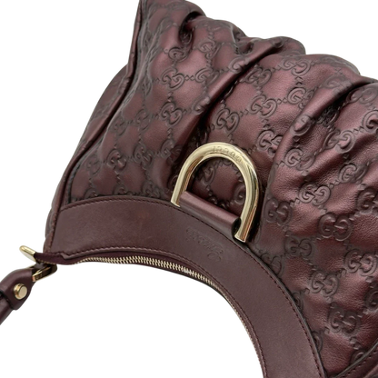 https://cdn.shopify.com/s/files/1/0564/9376/8855/files/Gucci_Schultertasche_D-Ring_medium_aus_Leder_monogram_lila_17.webp?v=1784283699