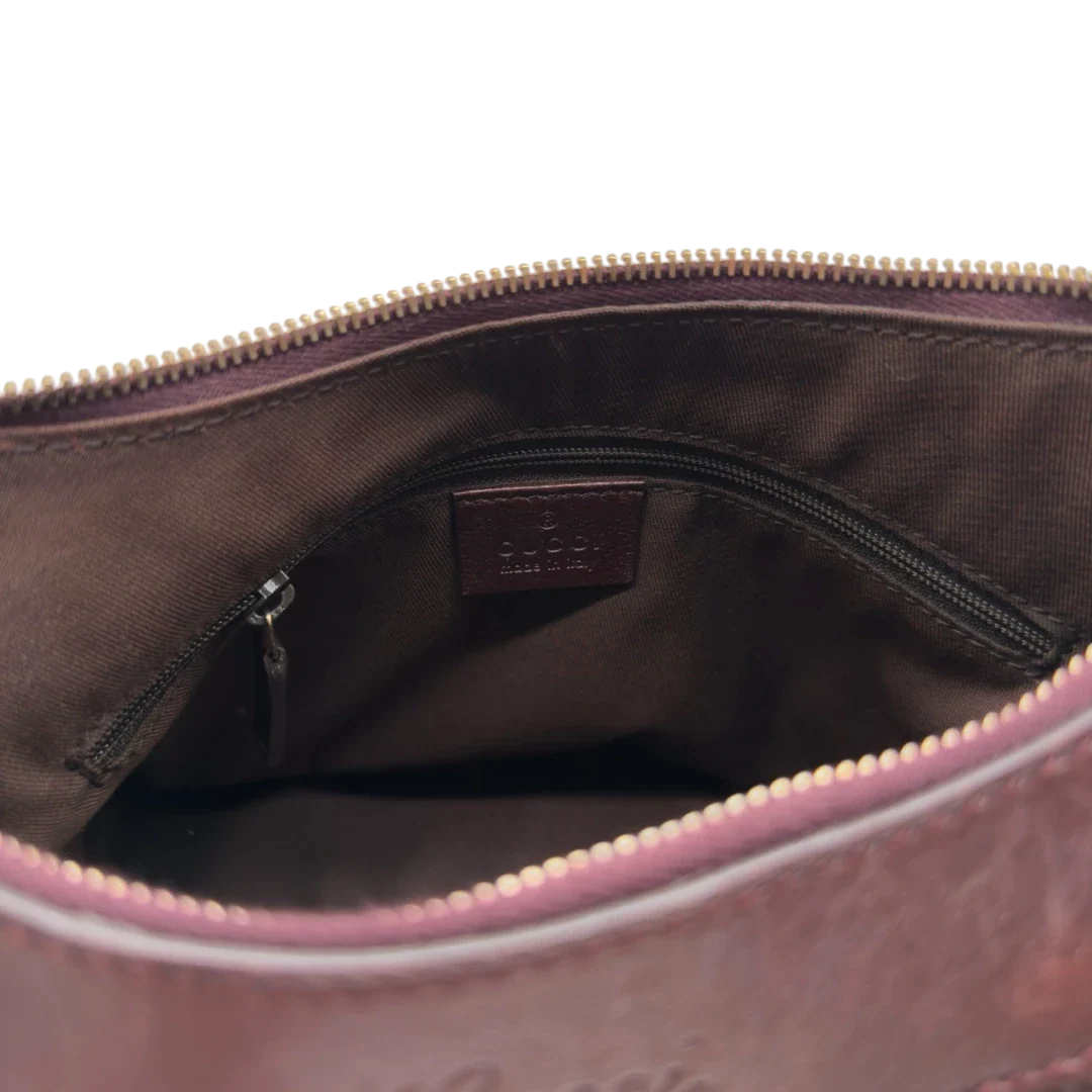 https://cdn.shopify.com/s/files/1/0564/9376/8855/files/Gucci_Schultertasche_D-Ring_medium_aus_Leder_monogram_lila_19.webp?v=1784283698