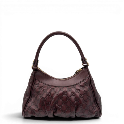 https://cdn.shopify.com/s/files/1/0564/9376/8855/files/Gucci_Schultertasche_D-Ring_medium_aus_Leder_monogram_lila_2.webp?v=1784283698