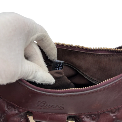 https://cdn.shopify.com/s/files/1/0564/9376/8855/files/Gucci_Schultertasche_D-Ring_medium_aus_Leder_monogram_lila_21.webp?v=1784283698