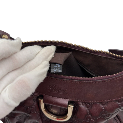 https://cdn.shopify.com/s/files/1/0564/9376/8855/files/Gucci_Schultertasche_D-Ring_medium_aus_Leder_monogram_lila_22.webp?v=1784283699