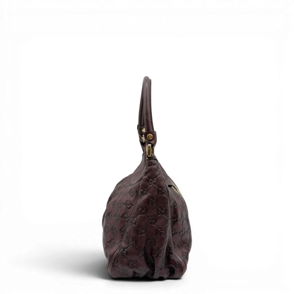 https://cdn.shopify.com/s/files/1/0564/9376/8855/files/Gucci_Schultertasche_D-Ring_medium_aus_Leder_monogram_lila_3.webp?v=1784283698