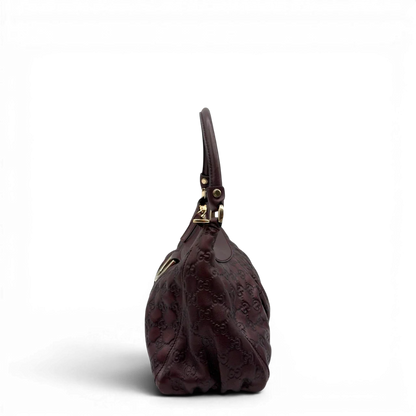 https://cdn.shopify.com/s/files/1/0564/9376/8855/files/Gucci_Schultertasche_D-Ring_medium_aus_Leder_monogram_lila_4.webp?v=1784283698