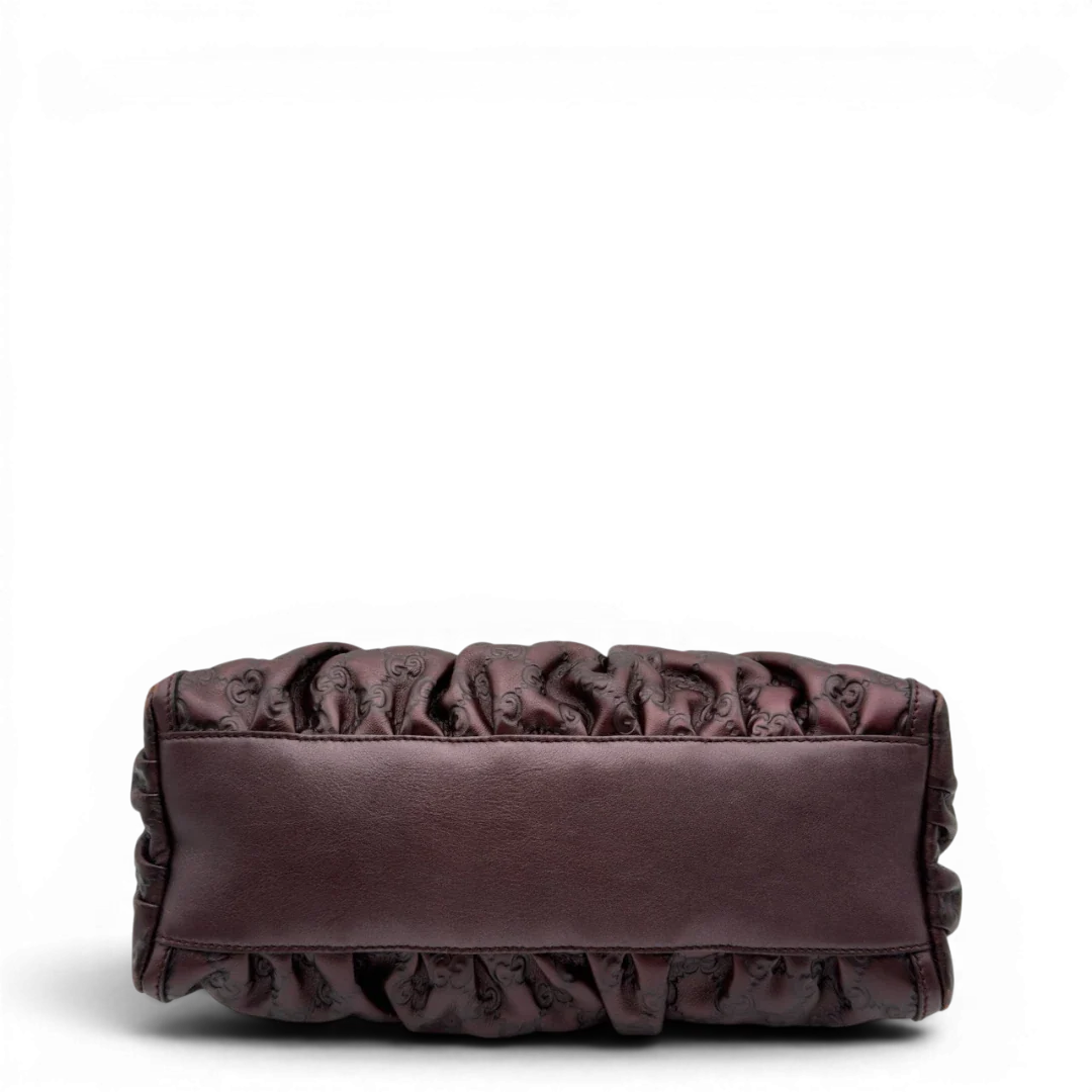 https://cdn.shopify.com/s/files/1/0564/9376/8855/files/Gucci_Schultertasche_D-Ring_medium_aus_Leder_monogram_lila_5.webp?v=1784283698