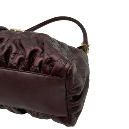 https://cdn.shopify.com/s/files/1/0564/9376/8855/files/Gucci_Schultertasche_D-Ring_medium_aus_Leder_monogram_lila_6.webp?v=1784283698