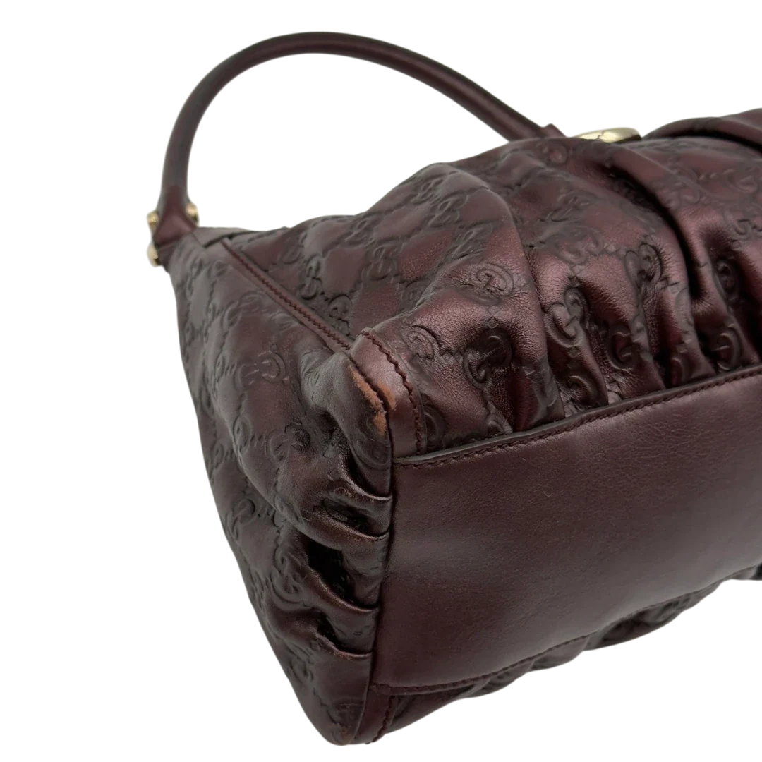 https://cdn.shopify.com/s/files/1/0564/9376/8855/files/Gucci_Schultertasche_D-Ring_medium_aus_Leder_monogram_lila_7.webp?v=1784283699