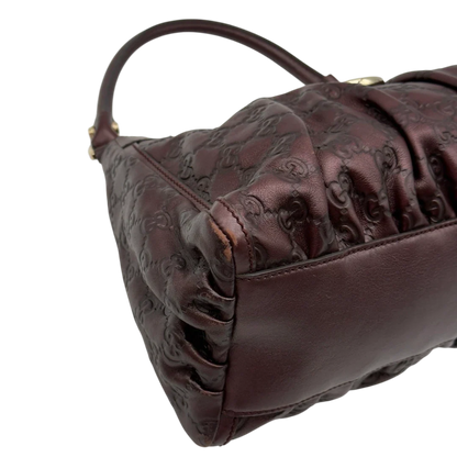 https://cdn.shopify.com/s/files/1/0564/9376/8855/files/Gucci_Schultertasche_D-Ring_medium_aus_Leder_monogram_lila_7.webp?v=1784283699