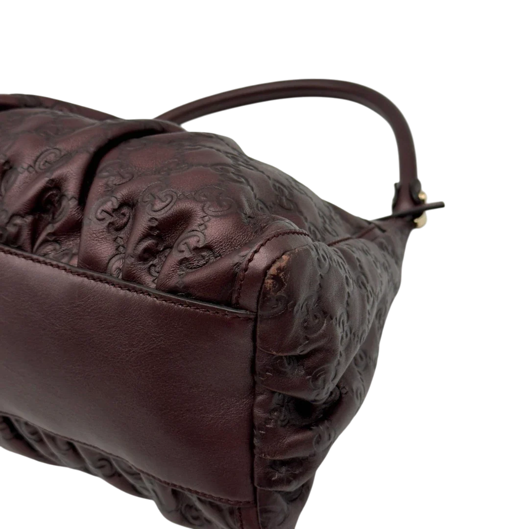 https://cdn.shopify.com/s/files/1/0564/9376/8855/files/Gucci_Schultertasche_D-Ring_medium_aus_Leder_monogram_lila_8.webp?v=1784283698