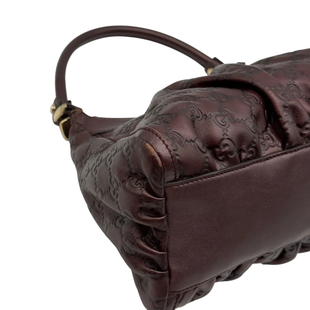 https://cdn.shopify.com/s/files/1/0564/9376/8855/files/Gucci_Schultertasche_D-Ring_medium_aus_Leder_monogram_lila_9.webp?v=1784283698