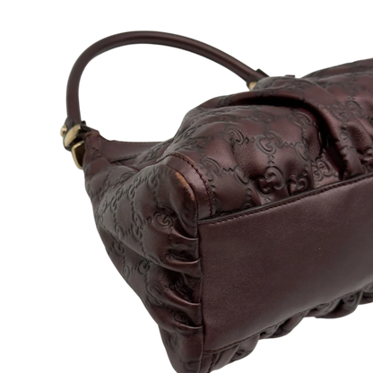 https://cdn.shopify.com/s/files/1/0564/9376/8855/files/Gucci_Schultertasche_D-Ring_medium_aus_Leder_monogram_lila_9.webp?v=1784283698
