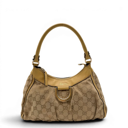 https://cdn.shopify.com/s/files/1/0564/9376/8855/files/Gucci_Schultertasche_D-Ring_medium_monogram_beige_1.webp?v=1782378063