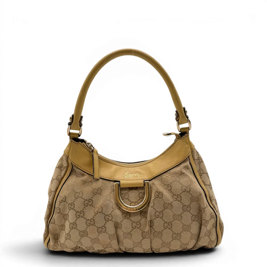 https://cdn.shopify.com/s/files/1/0564/9376/8855/files/Gucci_Schultertasche_D-Ring_medium_monogram_beige_1.webp?v=1782378063