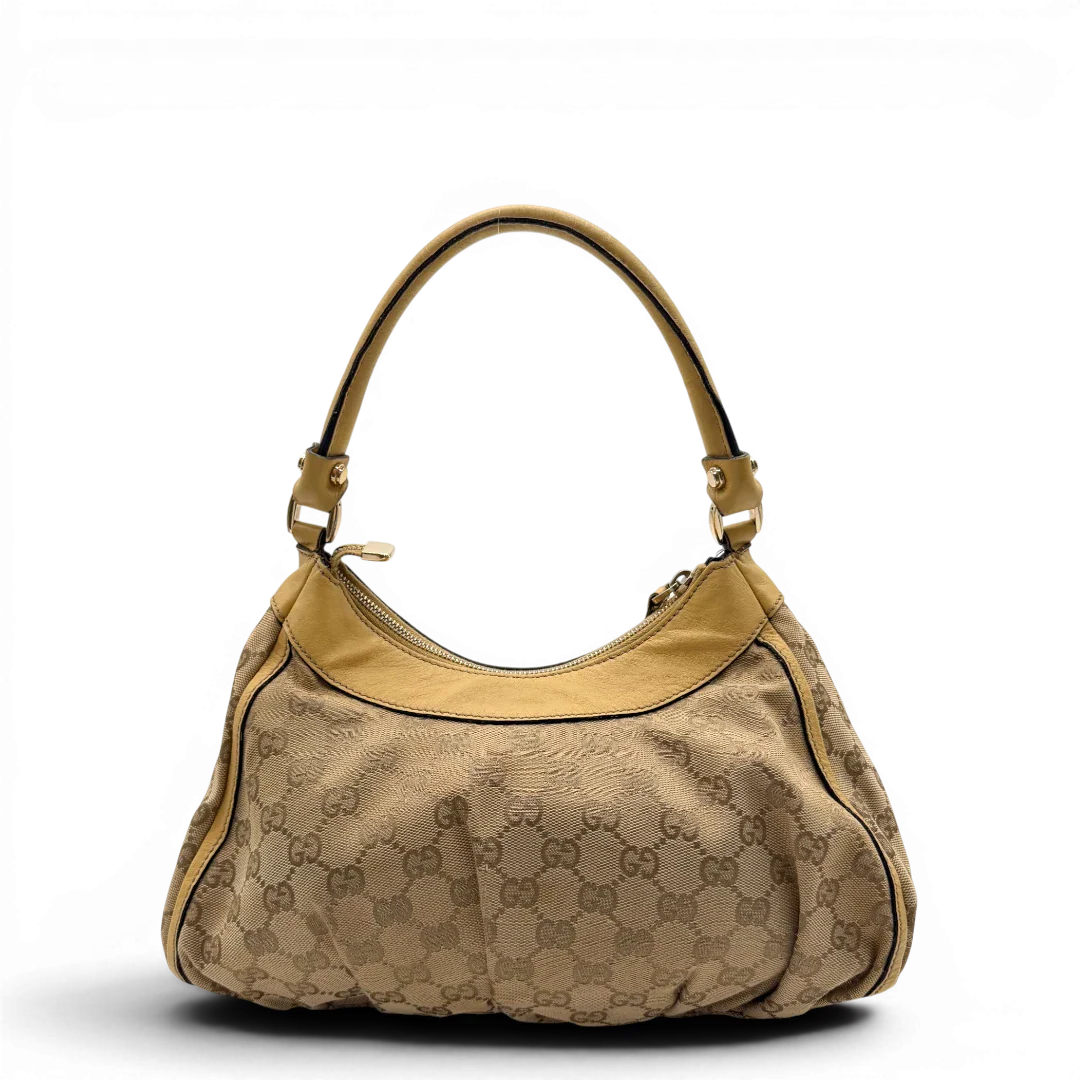 https://cdn.shopify.com/s/files/1/0564/9376/8855/files/Gucci_Schultertasche_D-Ring_medium_monogram_beige_2.webp?v=1782378063