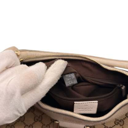 https://cdn.shopify.com/s/files/1/0564/9376/8855/files/Gucci_Schultertasche_D-Ring_medium_monogram_beige_25.webp?v=1784803466
