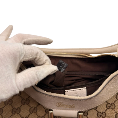 https://cdn.shopify.com/s/files/1/0564/9376/8855/files/Gucci_Schultertasche_D-Ring_medium_monogram_beige_26.webp?v=1784803466