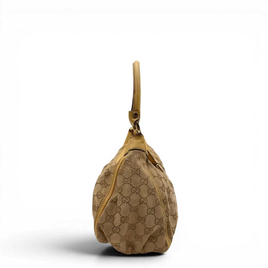 https://cdn.shopify.com/s/files/1/0564/9376/8855/files/Gucci_Schultertasche_D-Ring_medium_monogram_beige_4.webp?v=1782378062