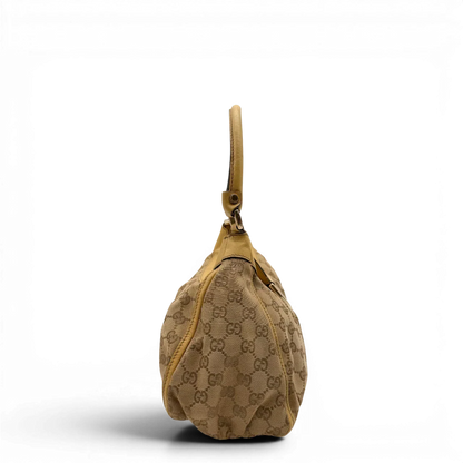 https://cdn.shopify.com/s/files/1/0564/9376/8855/files/Gucci_Schultertasche_D-Ring_medium_monogram_beige_4.webp?v=1782378062