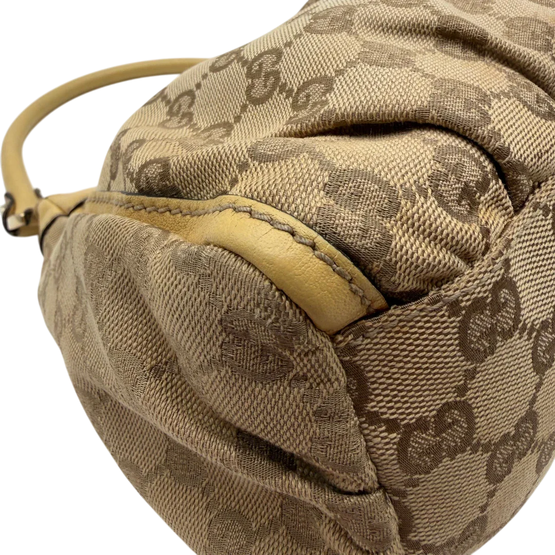 https://cdn.shopify.com/s/files/1/0564/9376/8855/files/Gucci_Schultertasche_D-Ring_medium_monogram_beige_7.webp?v=1782378064