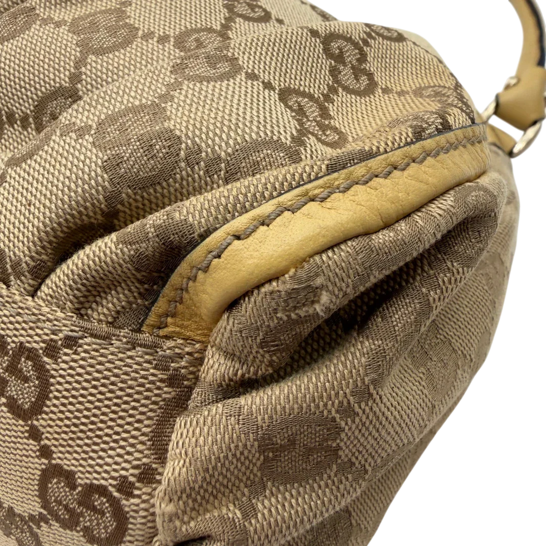 https://cdn.shopify.com/s/files/1/0564/9376/8855/files/Gucci_Schultertasche_D-Ring_medium_monogram_beige_8.webp?v=1782378064