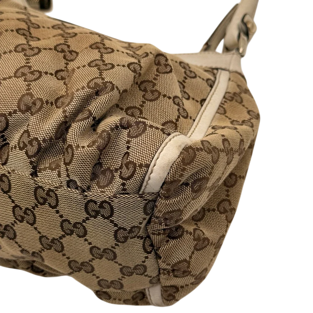 https://cdn.shopify.com/s/files/1/0564/9376/8855/files/Gucci_Schultertasche_D-Ring_medium_monogram_beige_8_4268f4c7-f972-4f54-af19-69883031b5f3.webp?v=1784803467