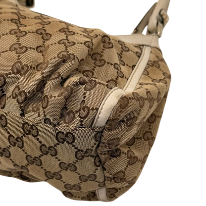 https://cdn.shopify.com/s/files/1/0564/9376/8855/files/Gucci_Schultertasche_D-Ring_medium_monogram_beige_8_4268f4c7-f972-4f54-af19-69883031b5f3.webp?v=1784803467