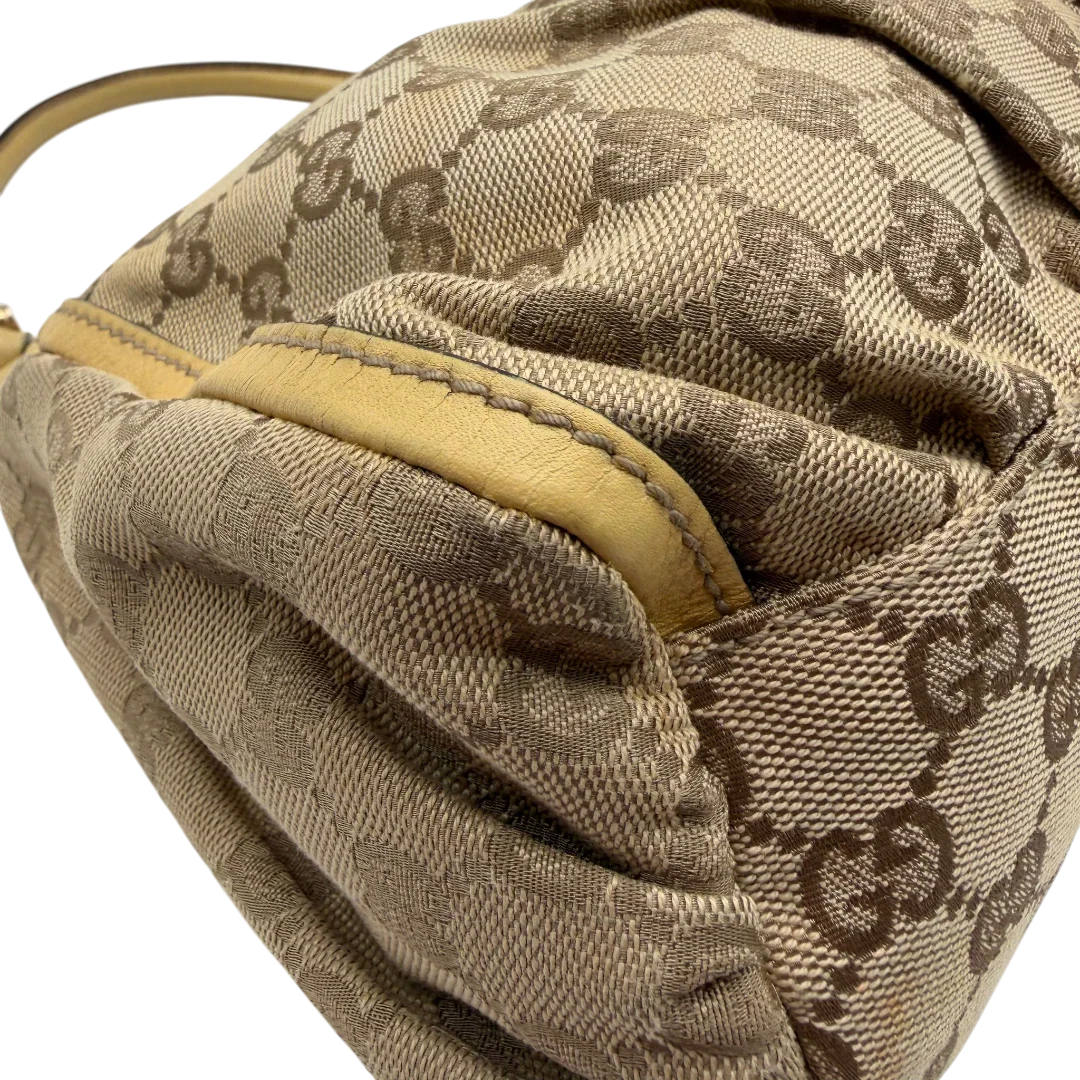 https://cdn.shopify.com/s/files/1/0564/9376/8855/files/Gucci_Schultertasche_D-Ring_medium_monogram_beige_9.webp?v=1782378064