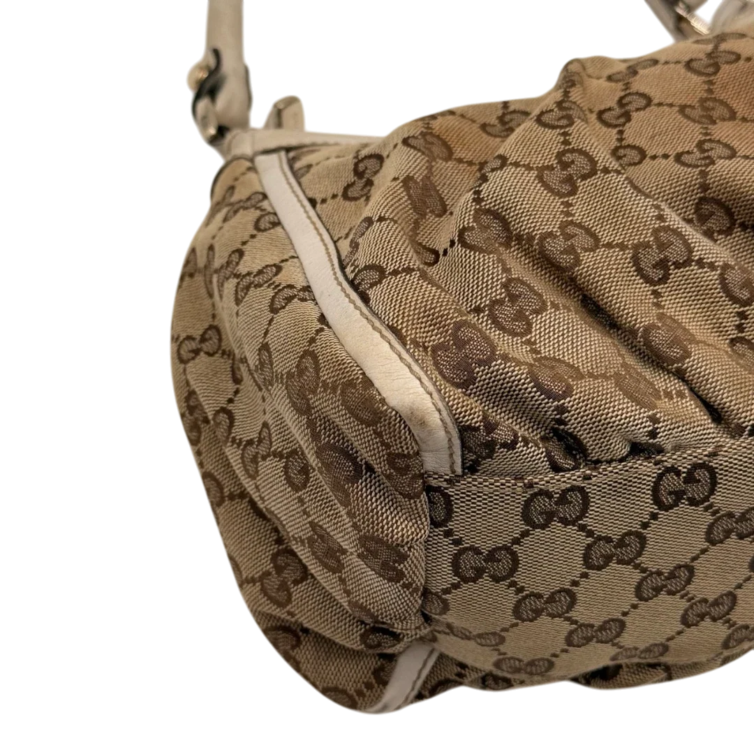 https://cdn.shopify.com/s/files/1/0564/9376/8855/files/Gucci_Schultertasche_D-Ring_medium_monogram_beige_9_7e5b26f7-5428-4d84-b255-7cd81ffda815.webp?v=1784803467