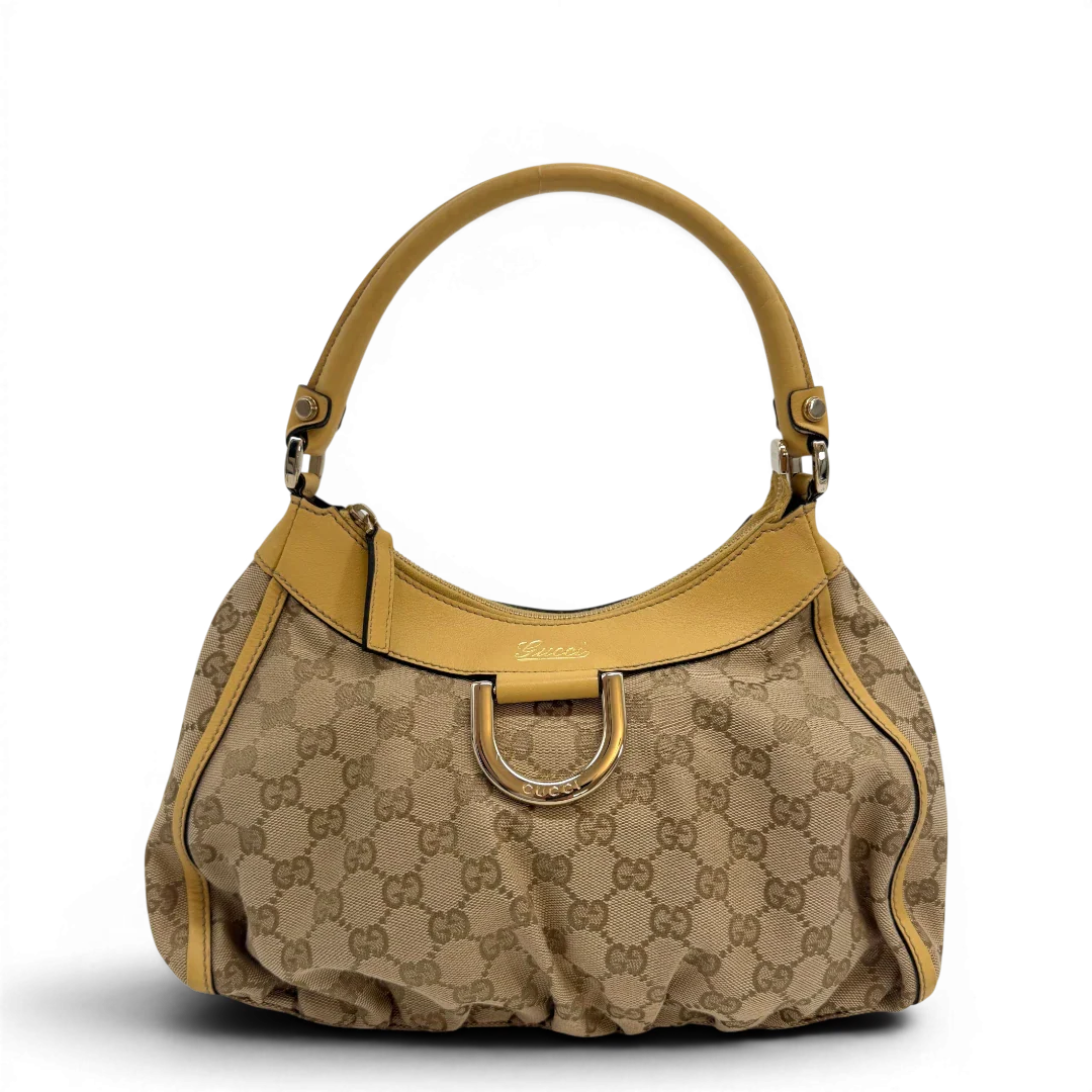 https://cdn.shopify.com/s/files/1/0564/9376/8855/files/Gucci_Schultertasche_D-Ring_medium_monogram_beige_vintage_GG6896.webp?v=1779286243