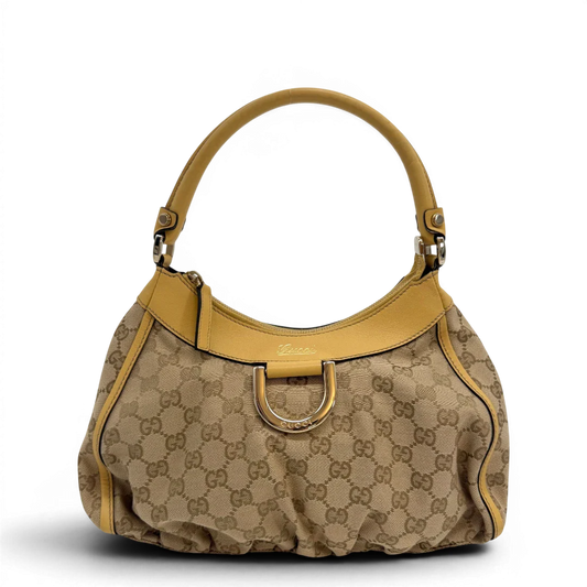 https://cdn.shopify.com/s/files/1/0564/9376/8855/files/Gucci_Schultertasche_D-Ring_medium_monogram_beige_vintage_GG6896.webp?v=1779286243