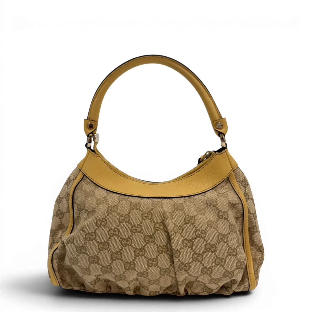 https://cdn.shopify.com/s/files/1/0564/9376/8855/files/Gucci_Schultertasche_D-Ring_medium_monogram_beige_vintage_GG6897.webp?v=1779286243