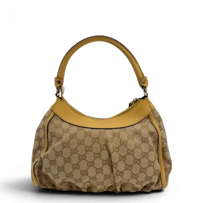 https://cdn.shopify.com/s/files/1/0564/9376/8855/files/Gucci_Schultertasche_D-Ring_medium_monogram_beige_vintage_GG6897.webp?v=1779286243