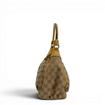 https://cdn.shopify.com/s/files/1/0564/9376/8855/files/Gucci_Schultertasche_D-Ring_medium_monogram_beige_vintage_GG6900.webp?v=1779286243