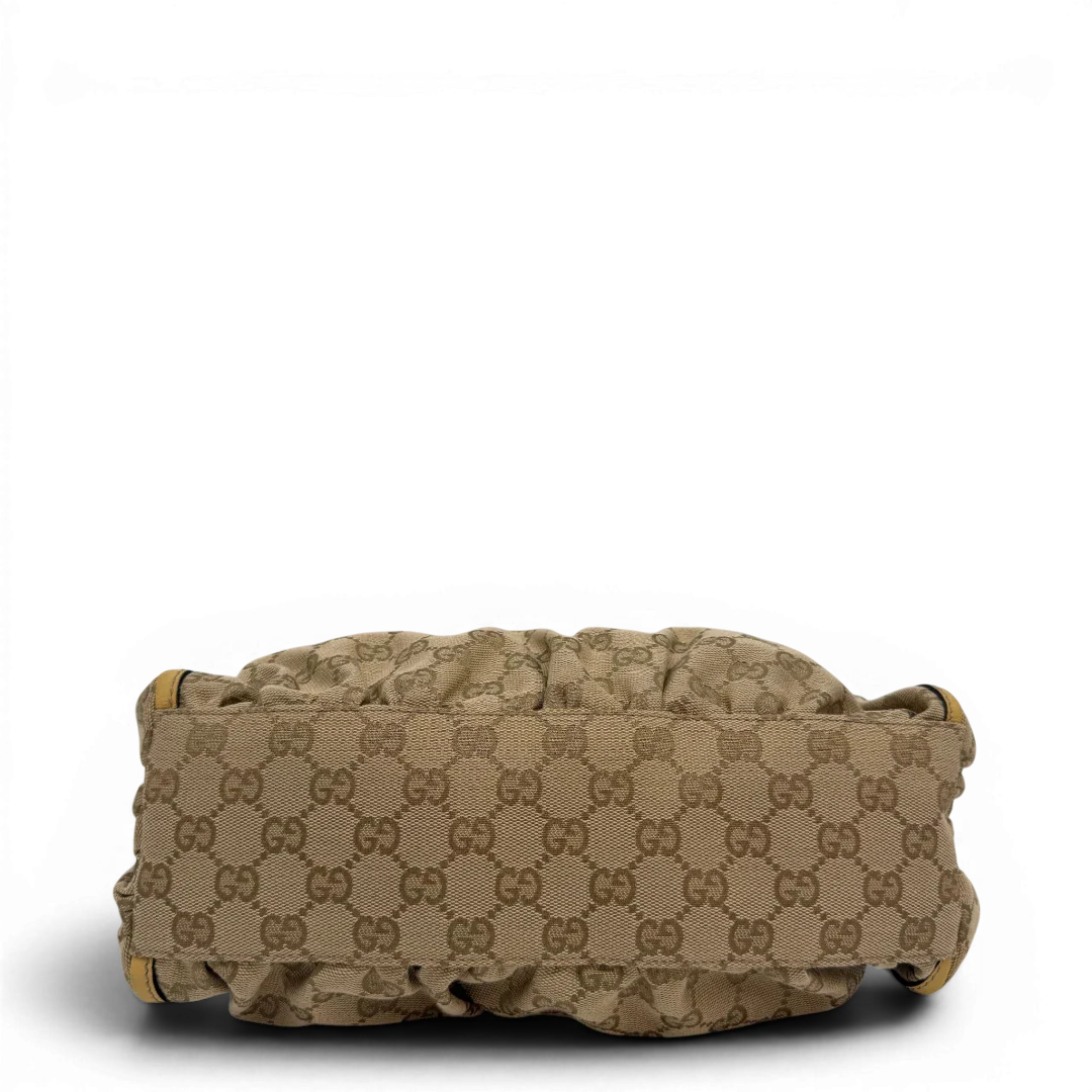 https://cdn.shopify.com/s/files/1/0564/9376/8855/files/Gucci_Schultertasche_D-Ring_medium_monogram_beige_vintage_GG6901.webp?v=1779286243